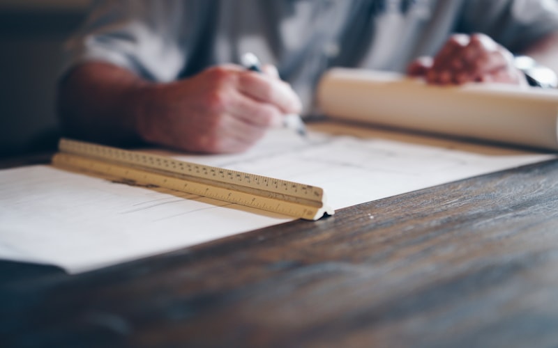 Architect working on blueprints
